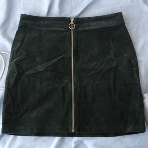 Velvet green mini skirt with zipper in front